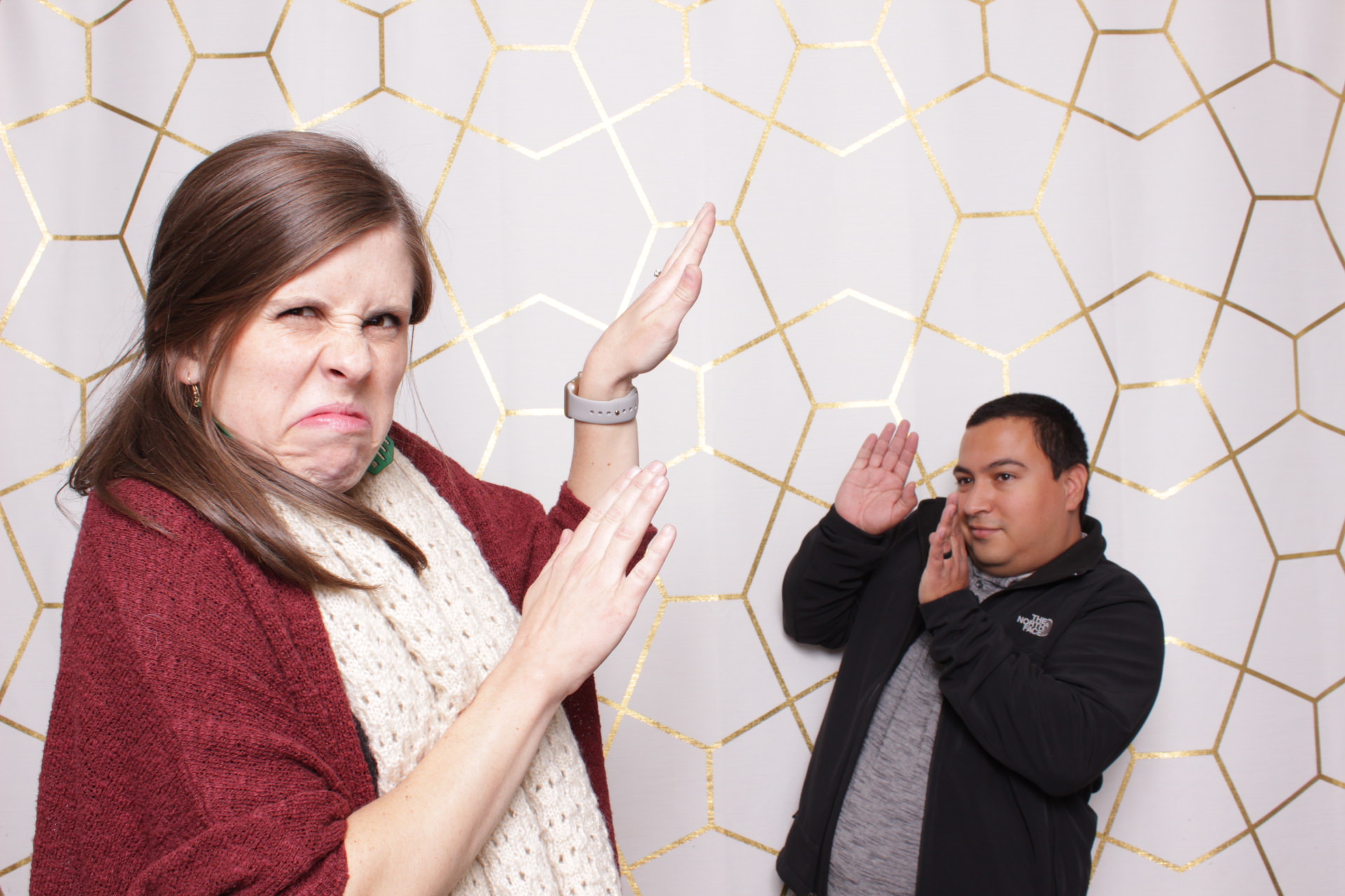 couple make a silly pose in a Fresno photo booth