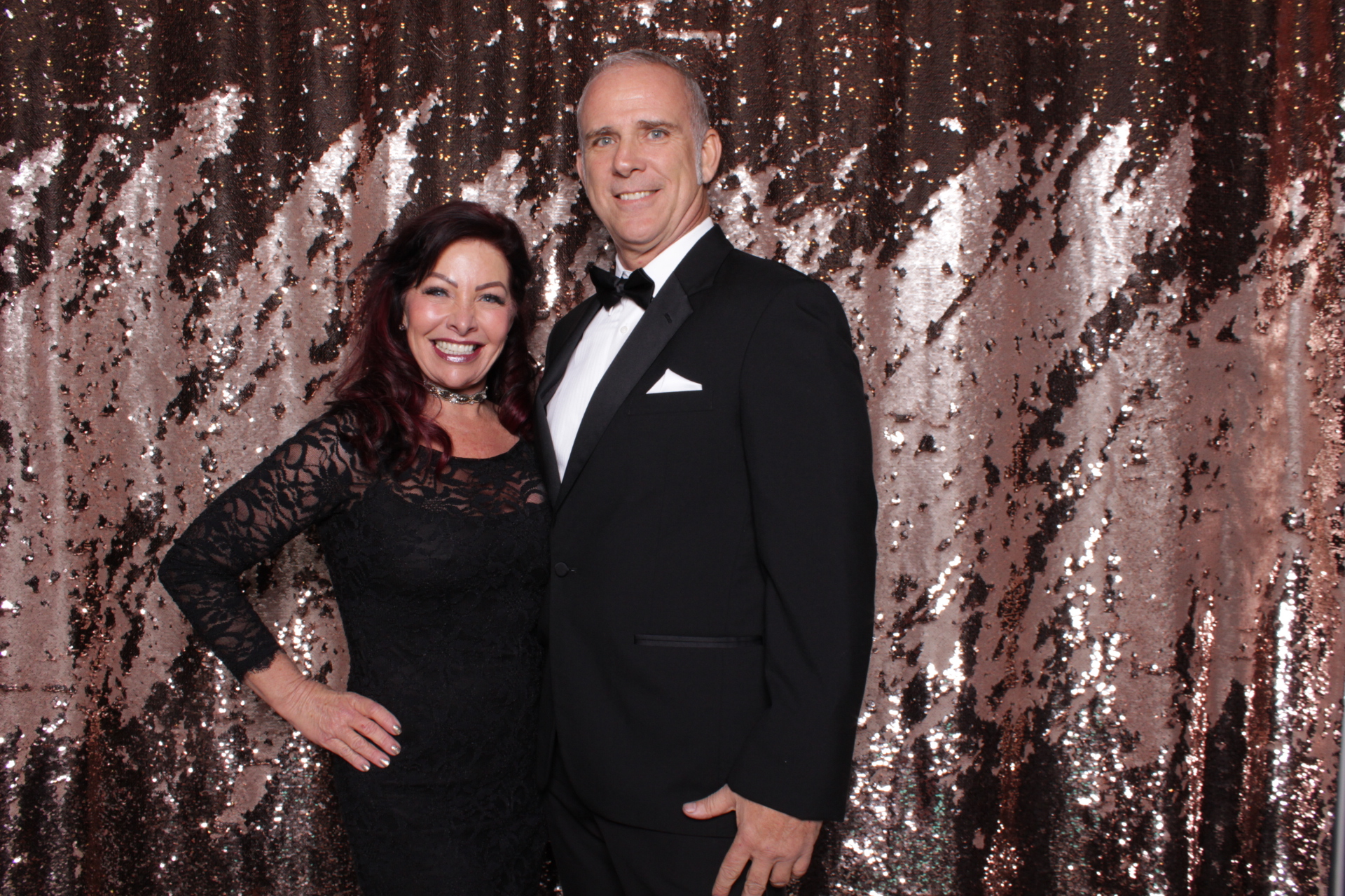 couple poses in fresno photo booth at fight with fashion