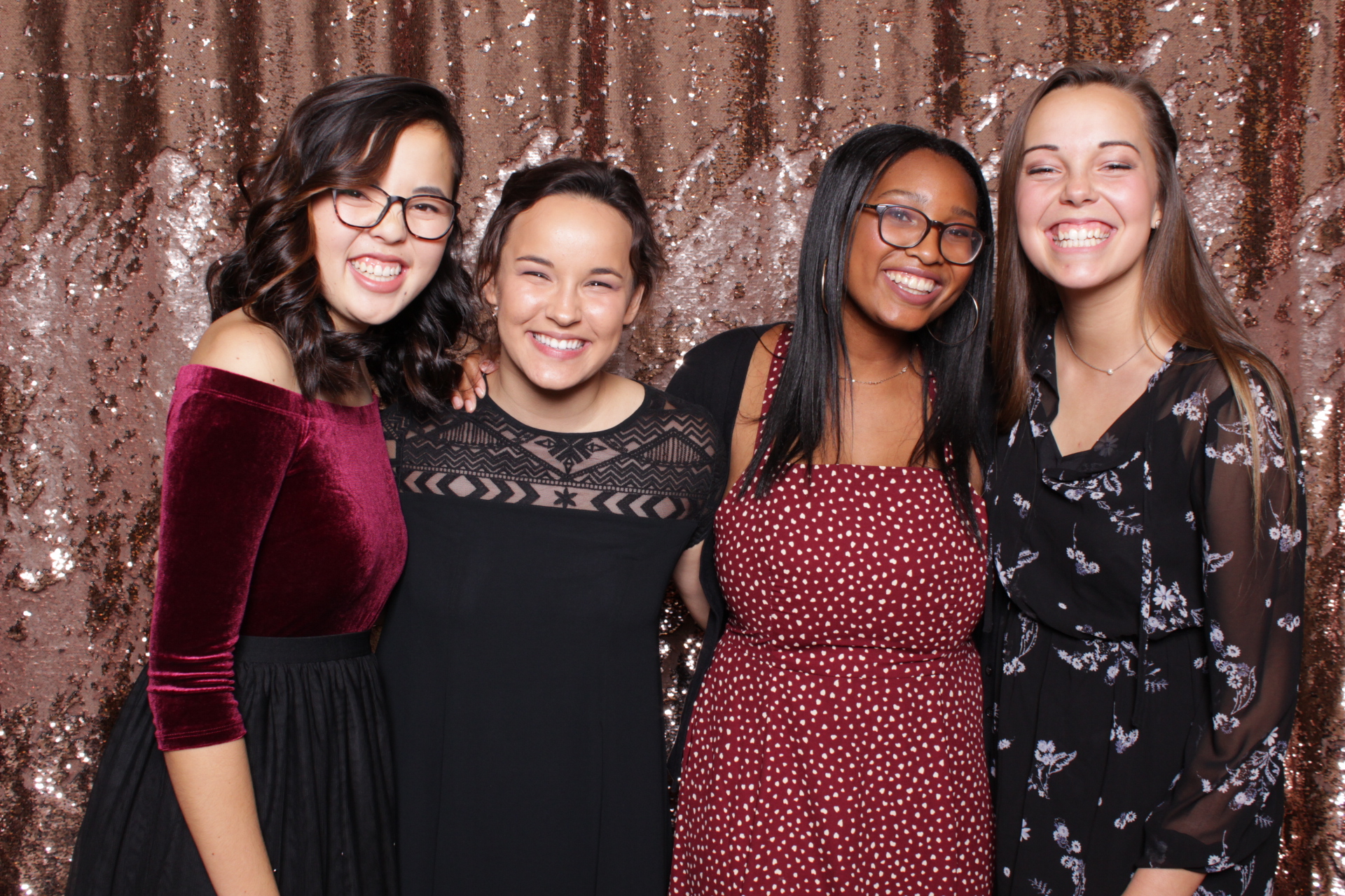 friends pose in yule photo booth