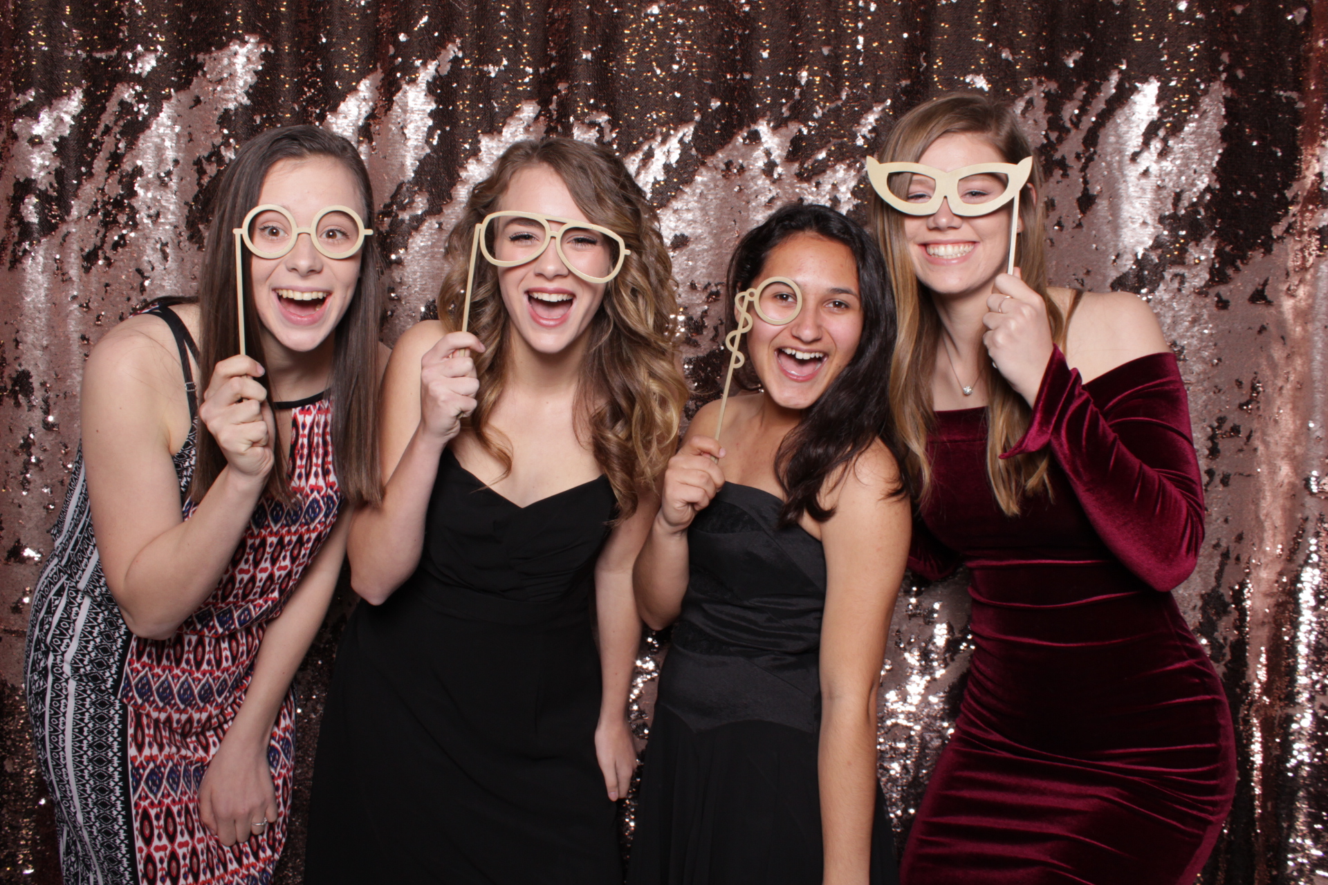 teenage friends pose in Fresno's best photo booth