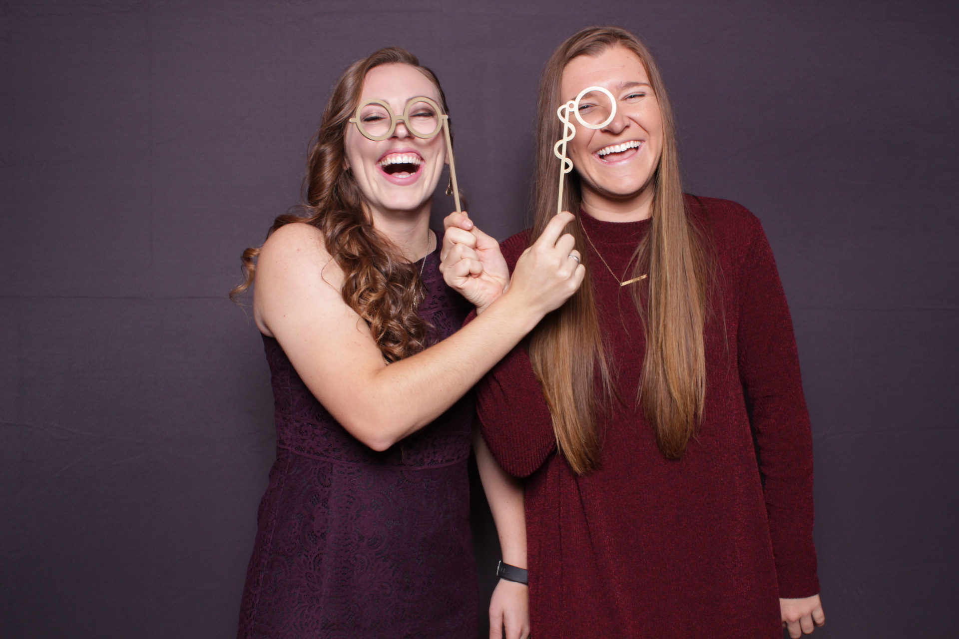 friends pose with glasses props