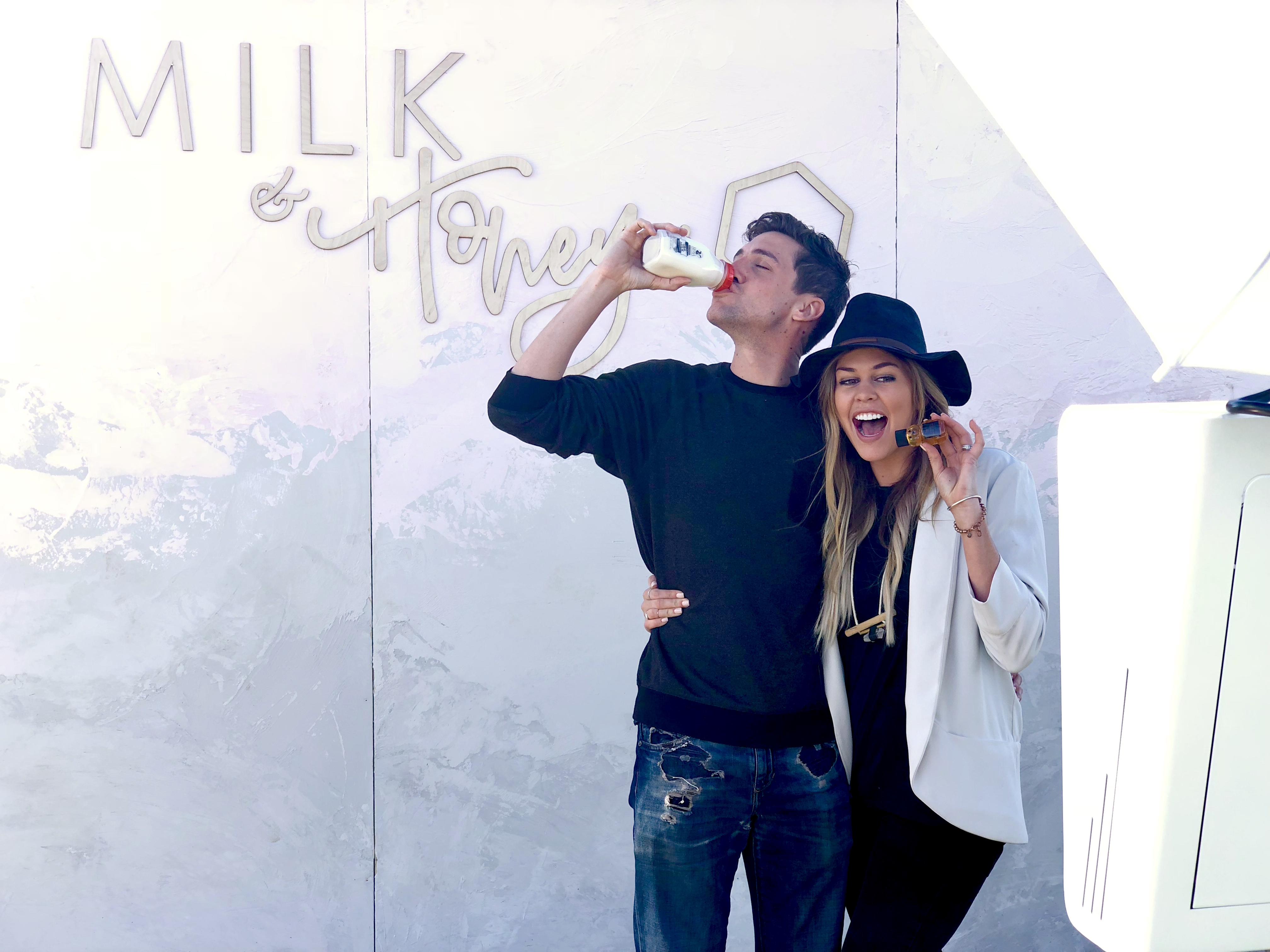 guests take photo in fresno photo booth at milk and honey event