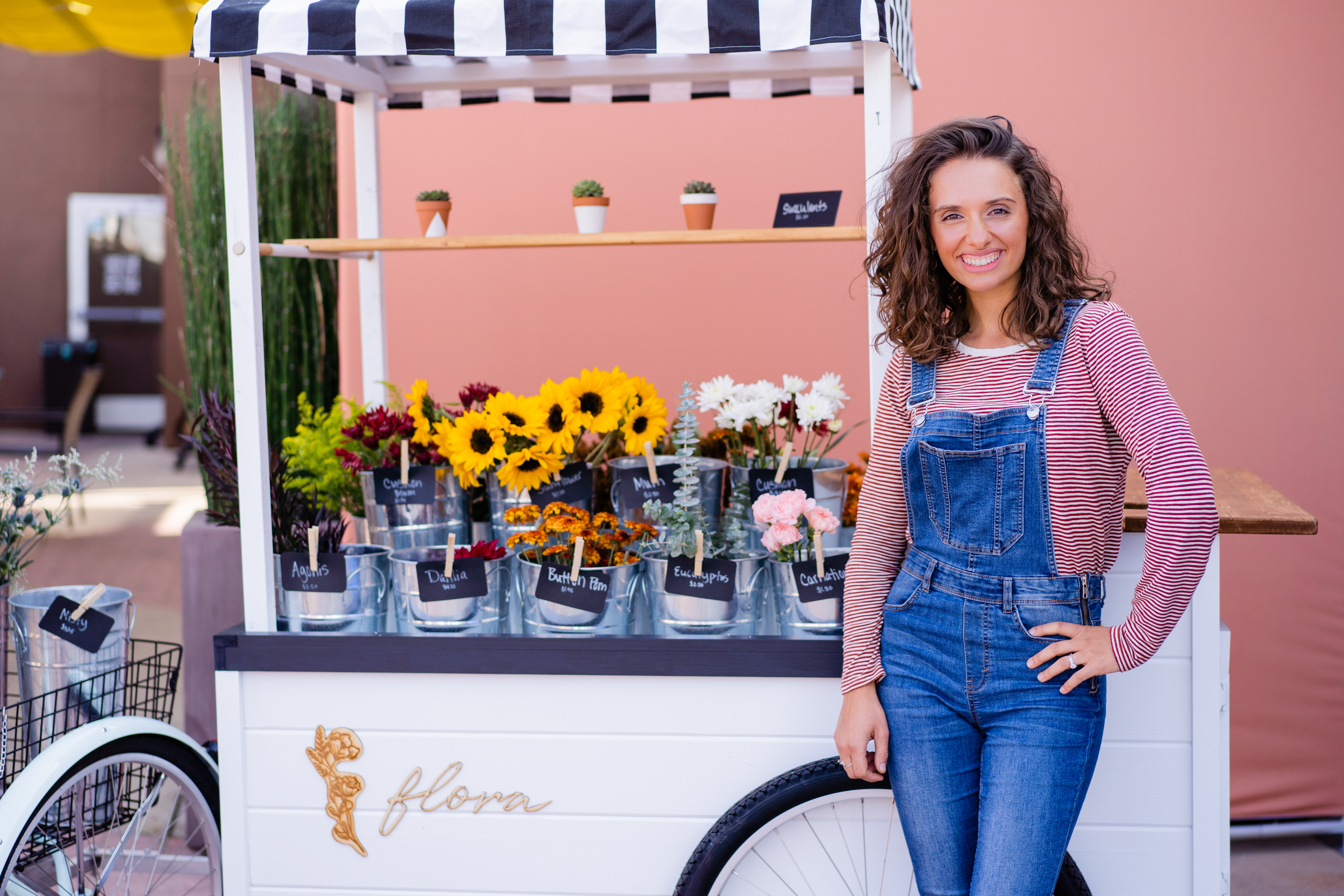 flora flower cart with red brick photo booth